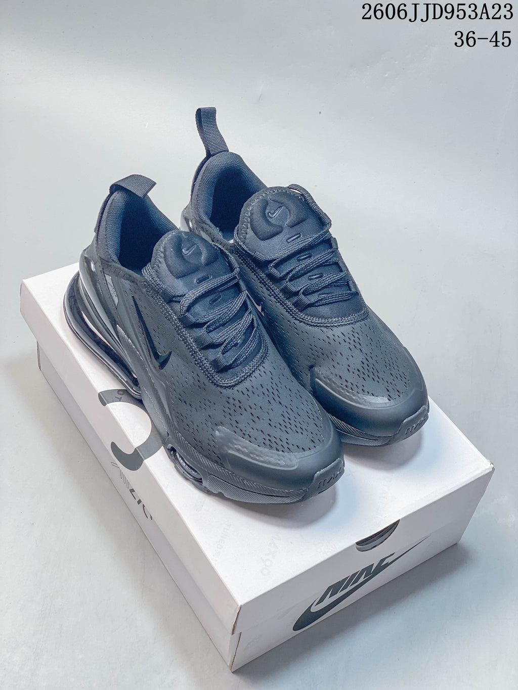 Pair of dark gray Nike Air Max 270 sneakers shown on a box.