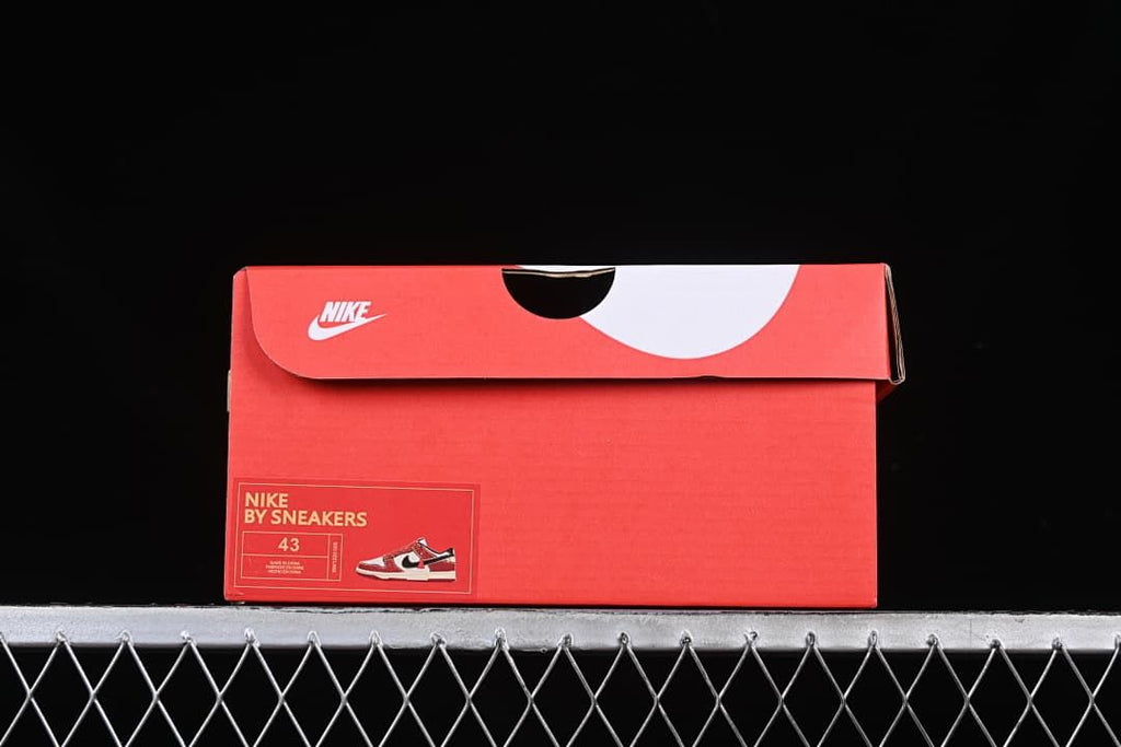 Red shoe box with a visible size label marked 43
