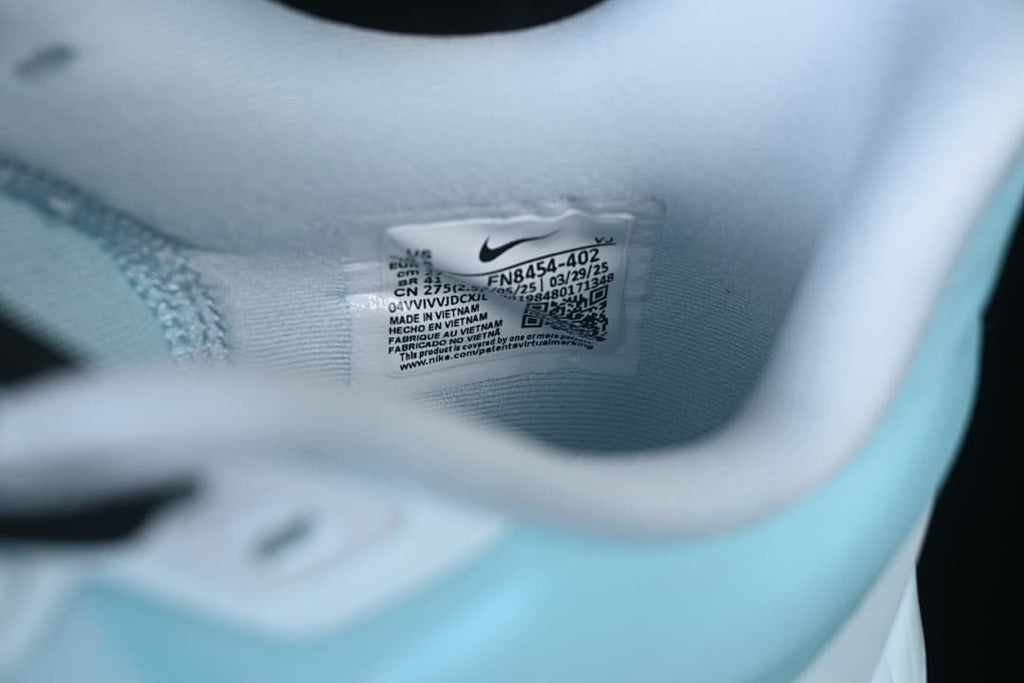 Close-up of the shoe's interior label showing style code FN8454-402 and EU size 43.