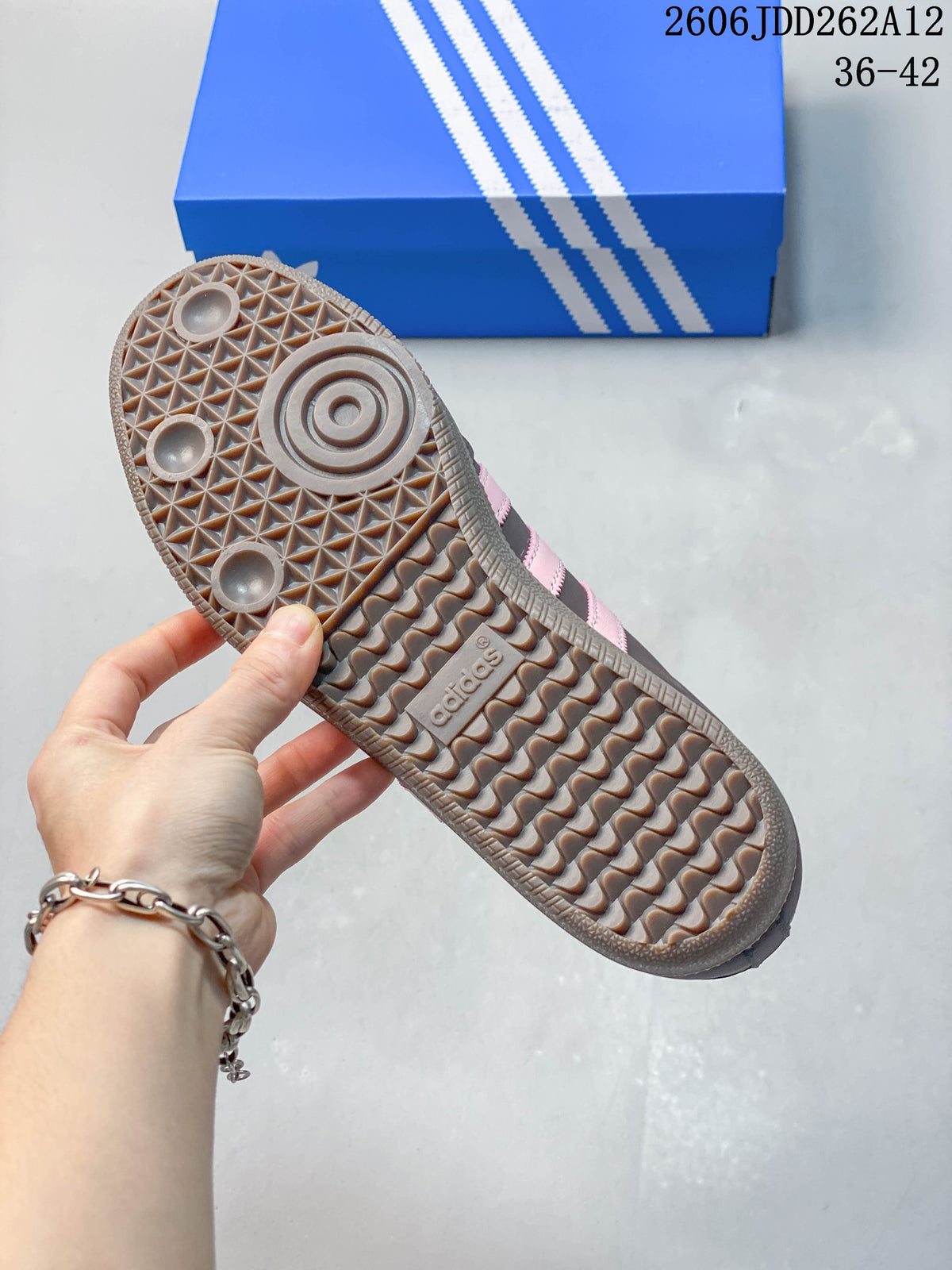 Underside of the sneaker showing a patterned textured outsole.