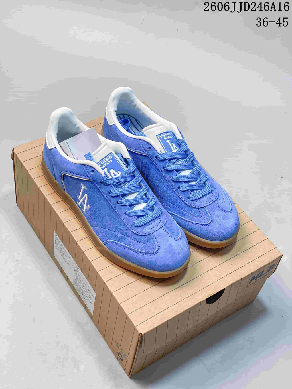 Blue Los Angeles Dodgers low-top sneakers with white accents, shown as a pair.