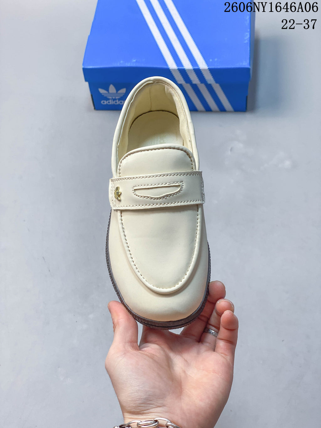 Top view of the cream loafer-style shoe with keeper strap