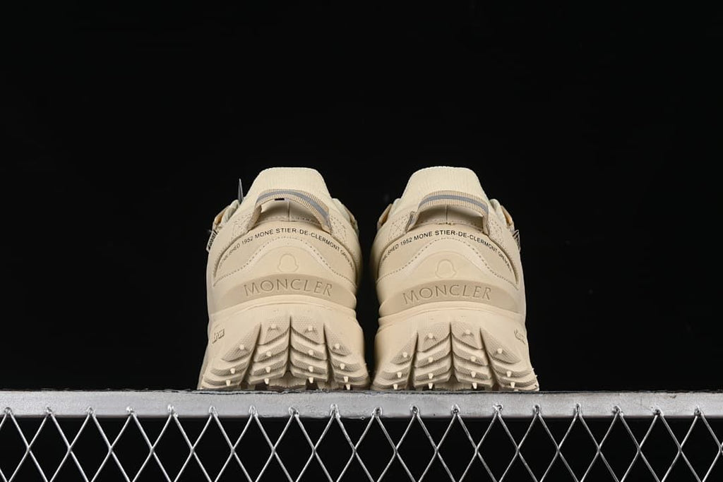 Rear view of both sneakers showing heel details and tread.