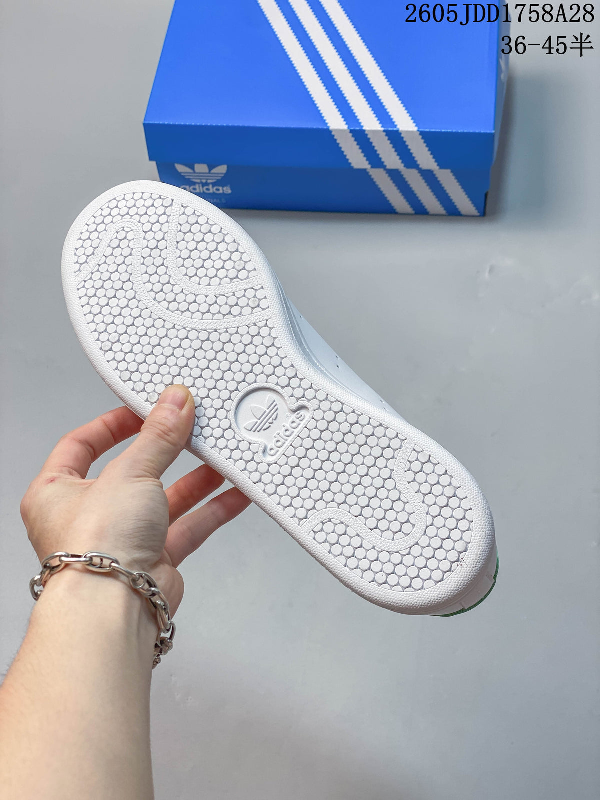 Textured outsole of a white Adidas sneaker