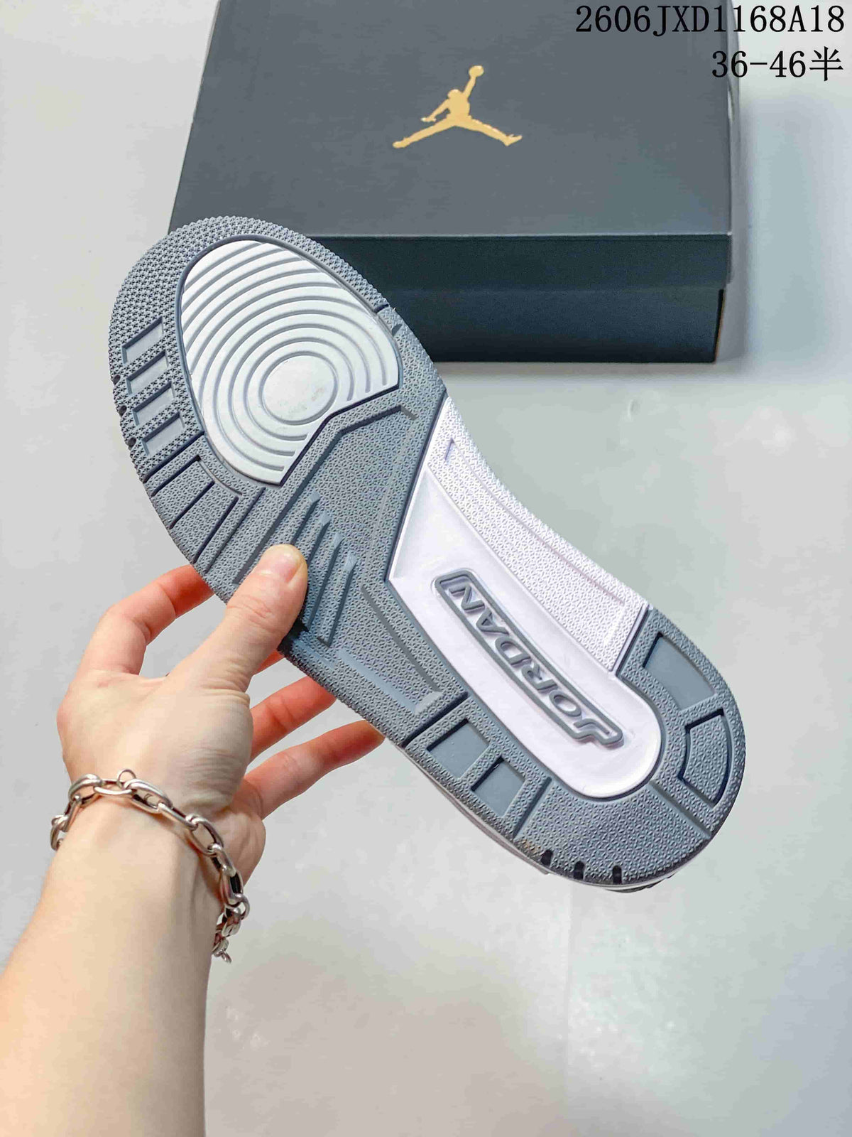 Grey and white outsole of a Jordan Legacy 312 sneaker