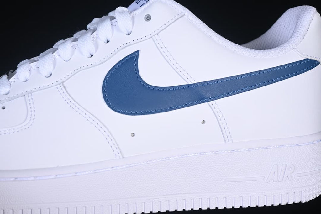 Close-up of the navy Swoosh on the white sneaker side