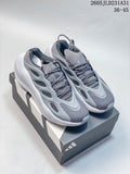 Pair of grey Adidas Hyperboost sneakers on a shoebox, showing the sculpted side panels and white soles.