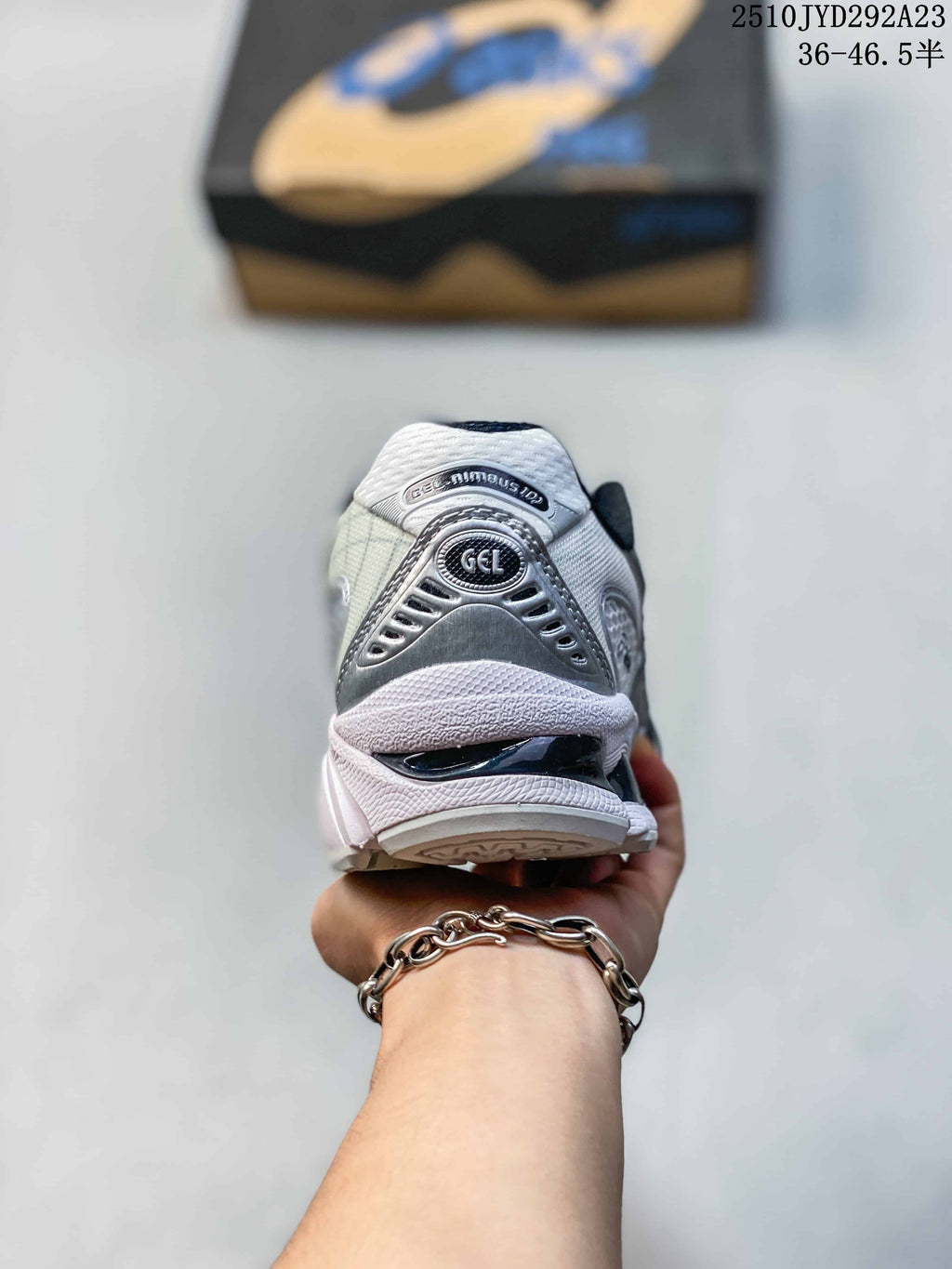 Rear view of the silver and white ASICS sneaker