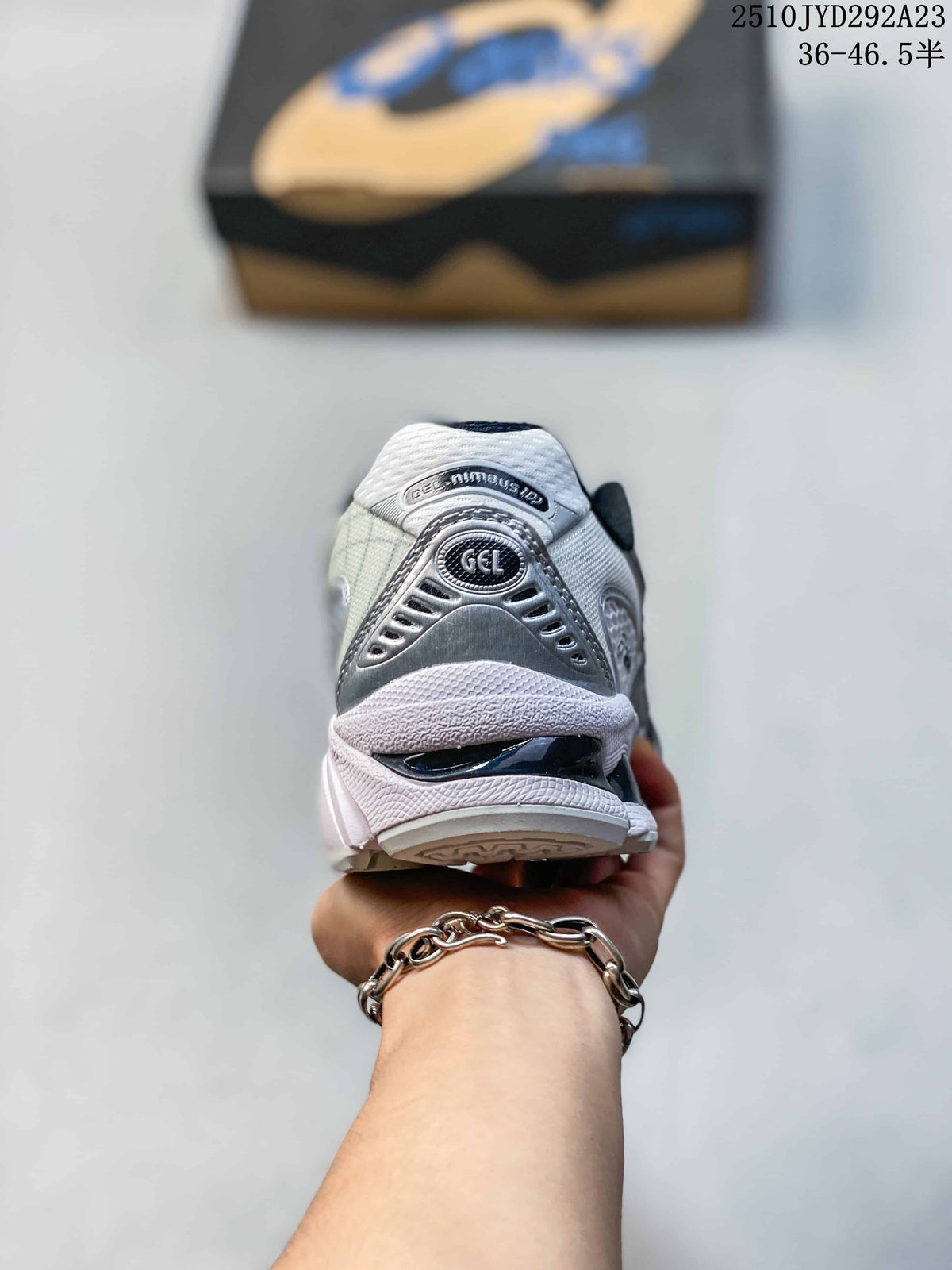 Rear view of the silver and white ASICS sneaker