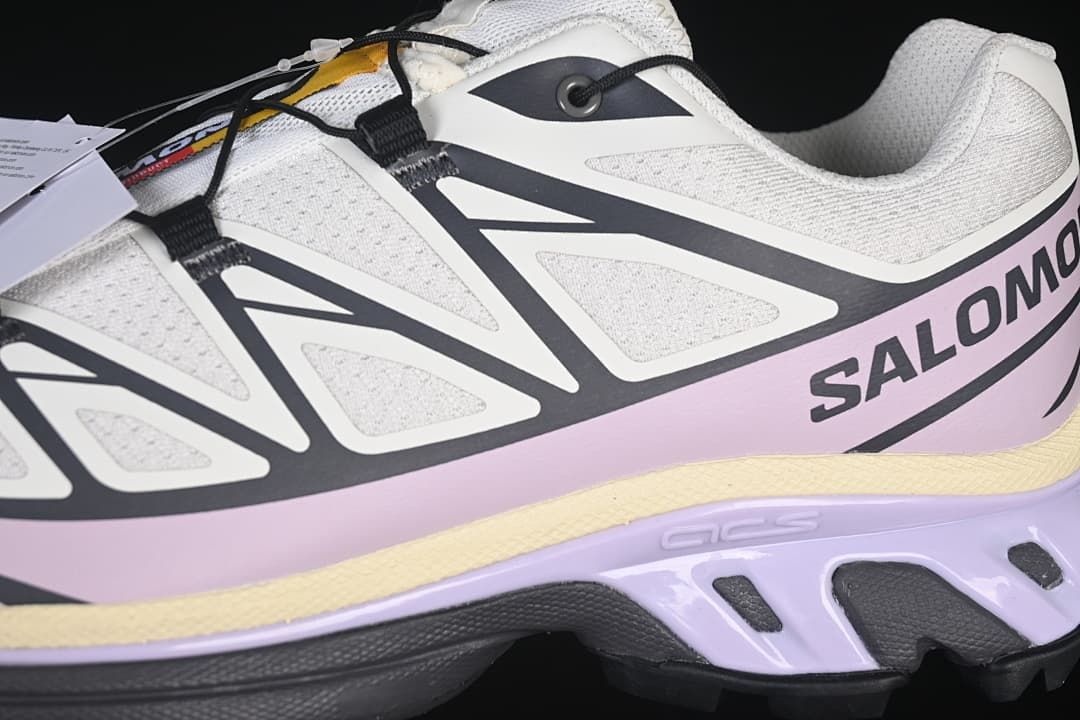 Close-up of side overlays, lilac panel, and sole details