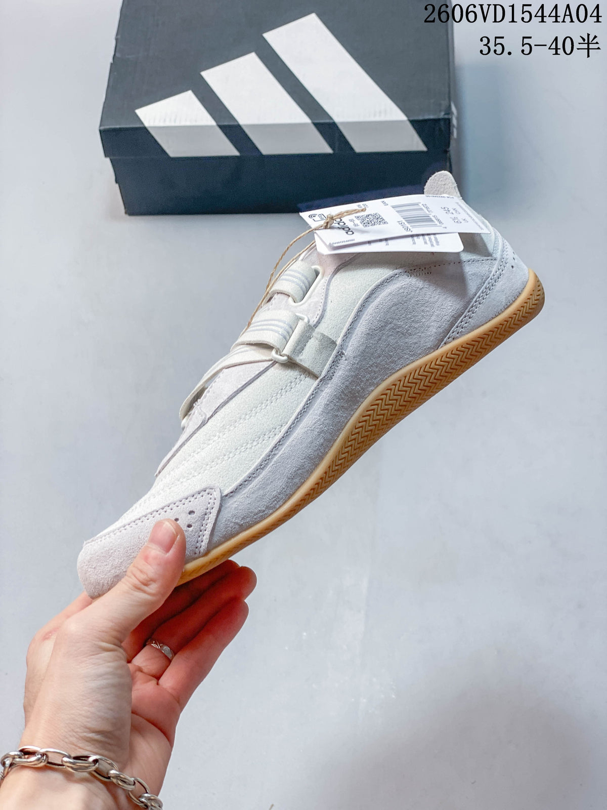 Side view of the adidas Urban Reverie sneaker with layered panels and a gum-colored outsole