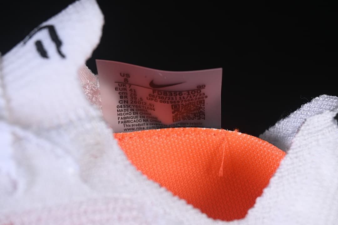 Close-up of the shoe label and orange lining