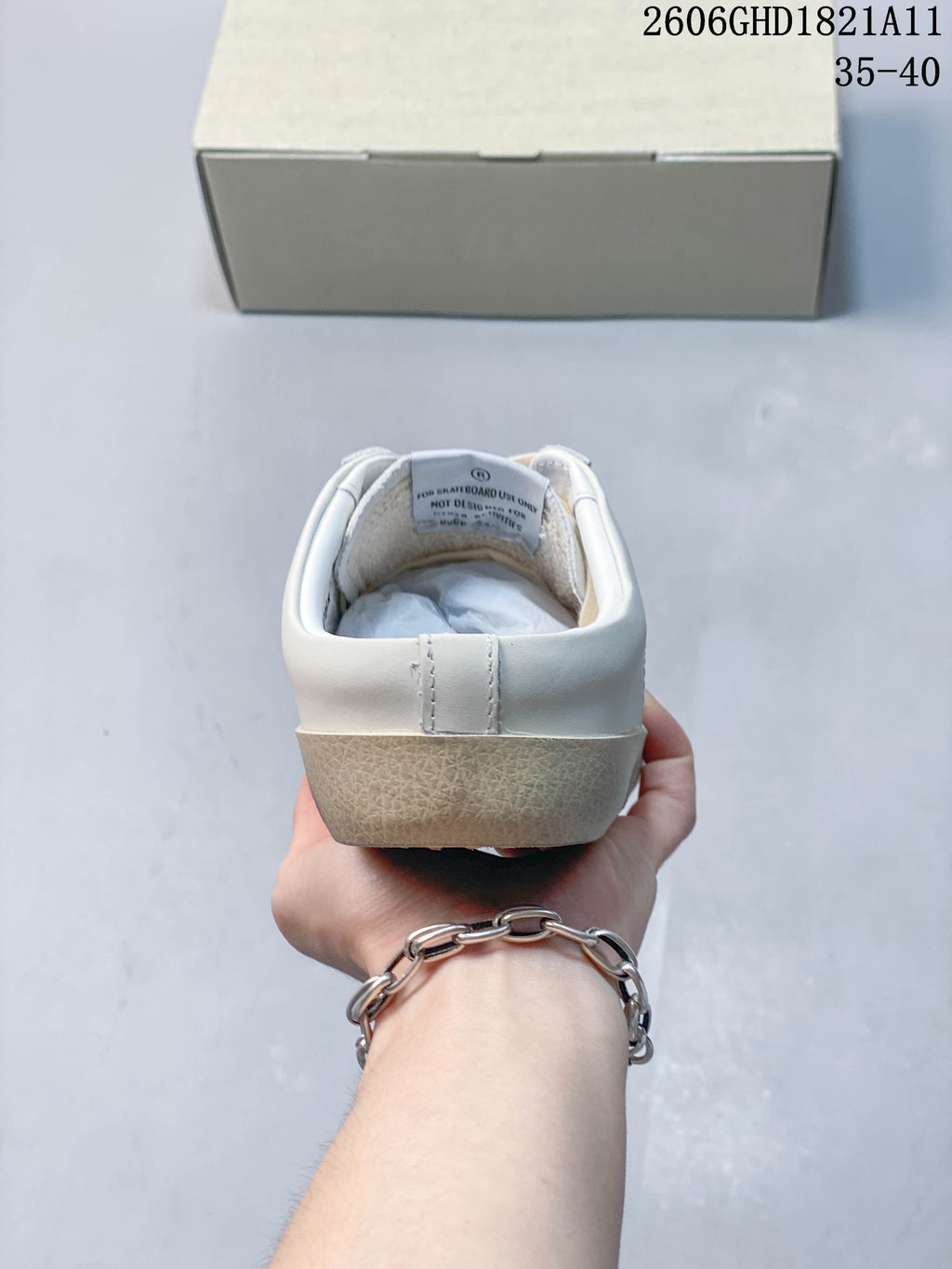 Rear view of the sneaker with a beige-toned heel sole