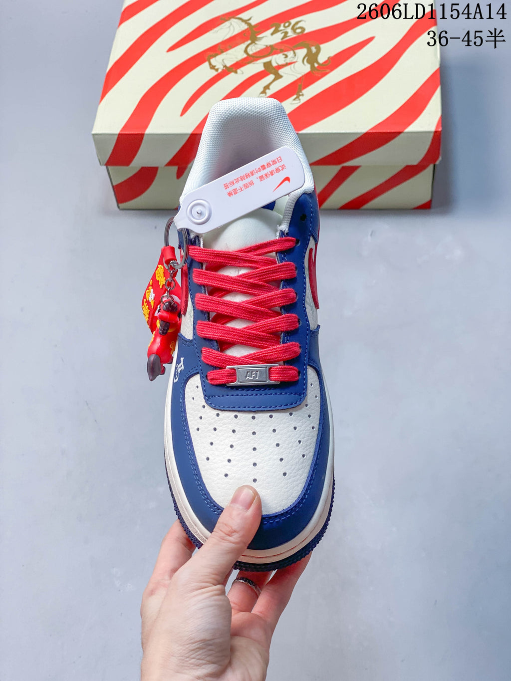 Top view of the sneaker with perforated toe panel and red laces
