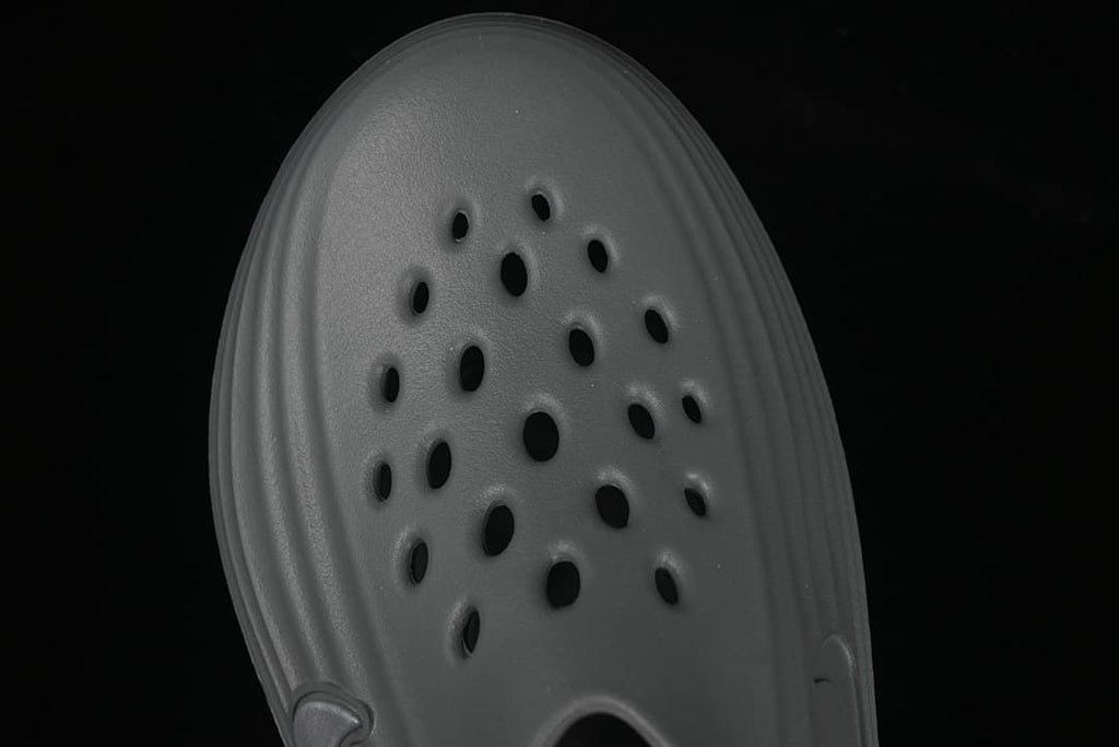 Top view highlighting the perforated upper of the grey clog