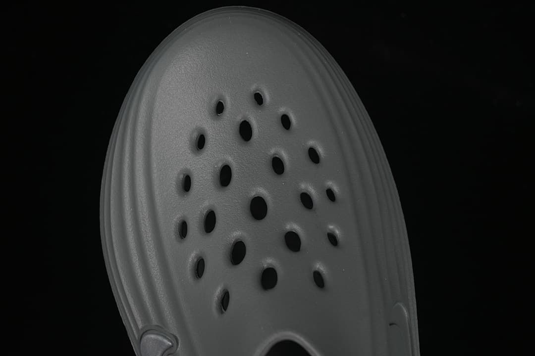 Top view highlighting the perforated upper of the grey clog