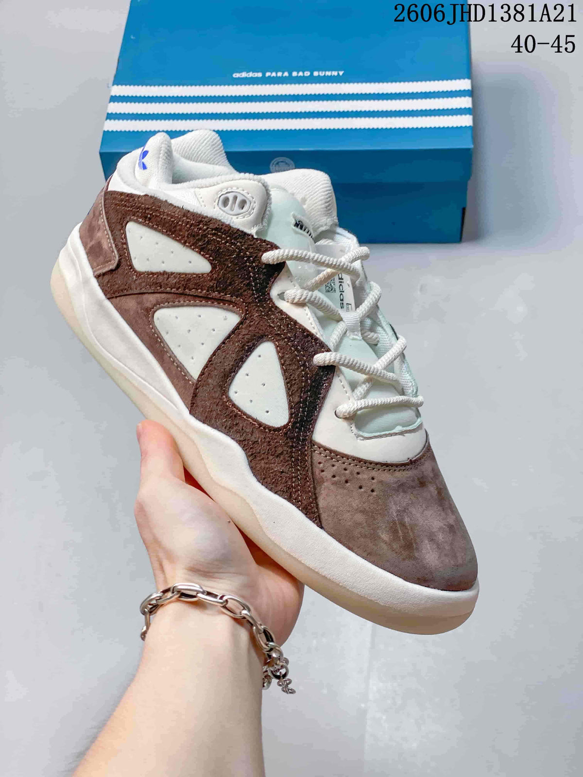 Close view of a taupe, brown, and off-white Badbo 1.0 sneaker with perforated side panels
