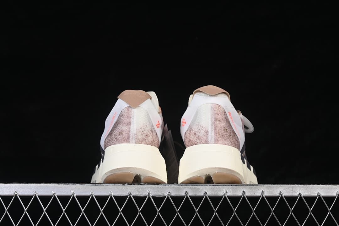 Rear view of both shoes showing the patterned heels
