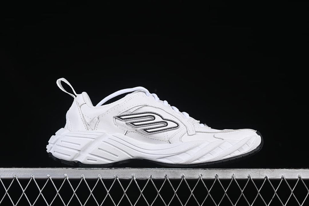 Side profile of the white sneaker with a chunky sculpted sole
