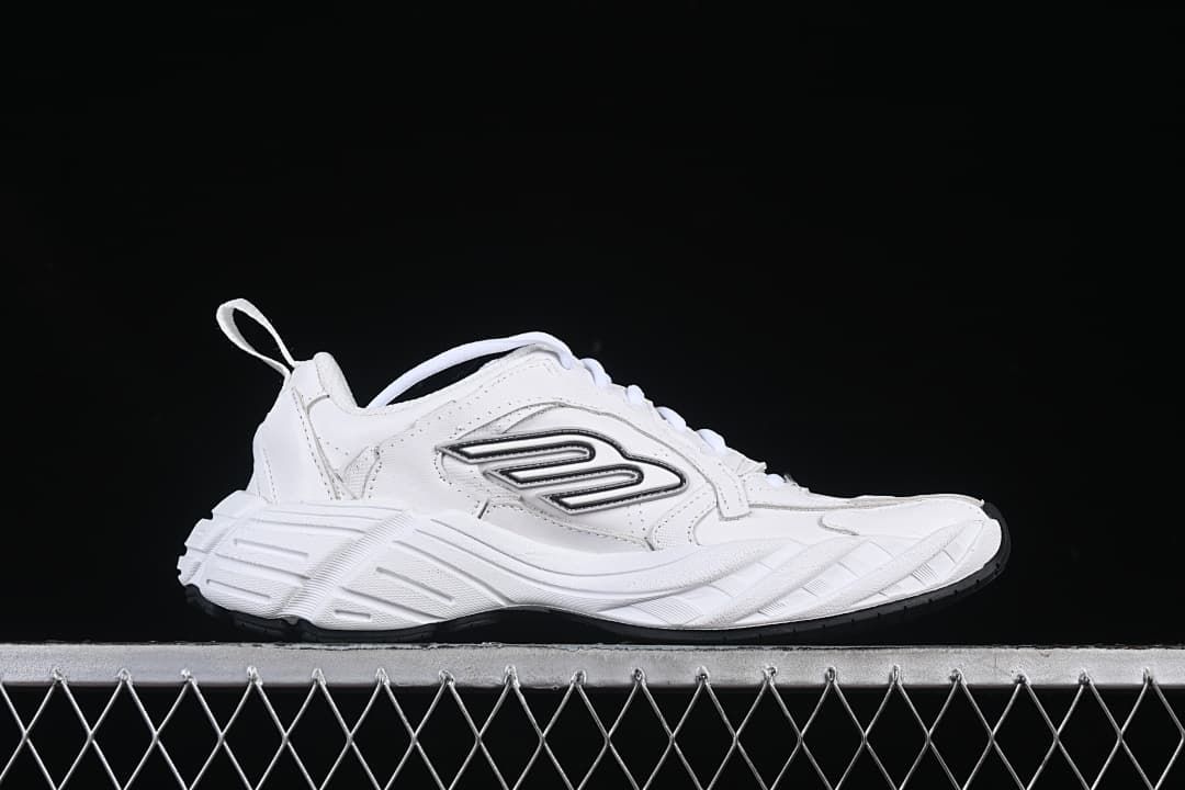 Side profile of the white sneaker with a chunky sculpted sole