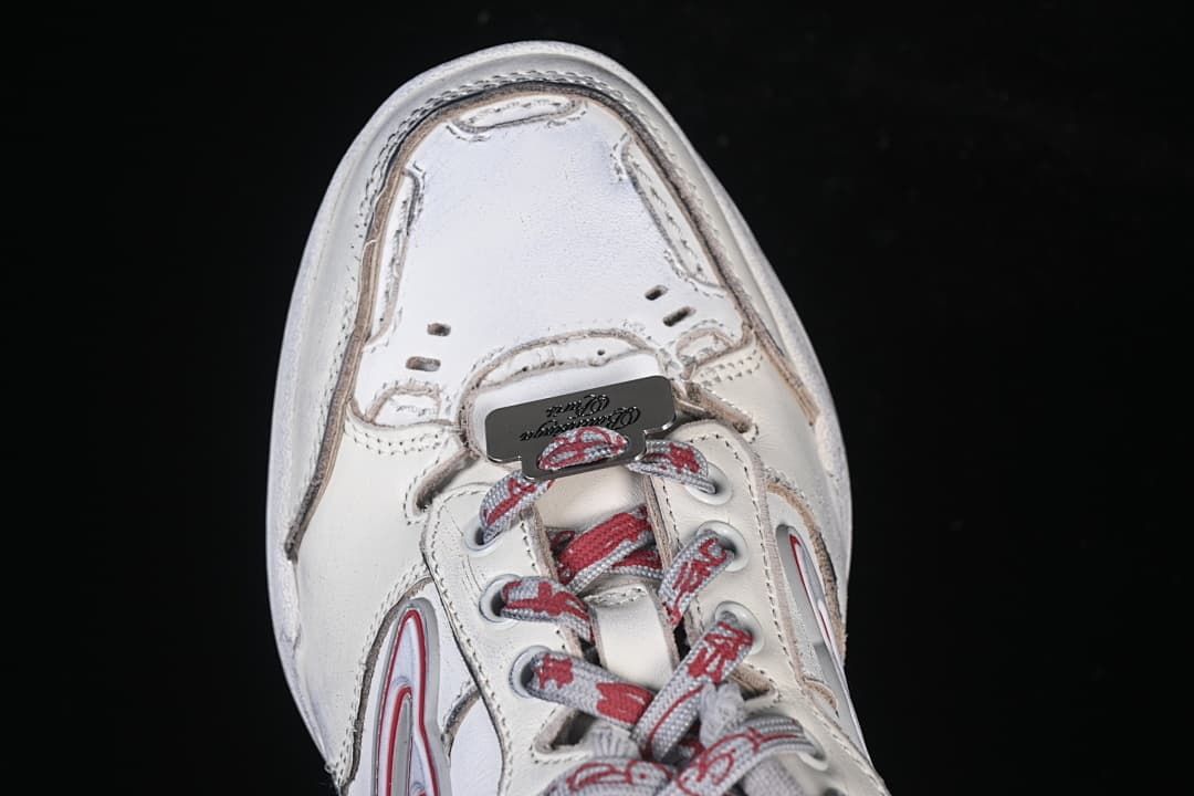 Top-down detail of the sneaker toe and lacing