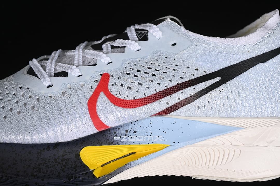Close-up of perforated upper, Swoosh details, and colored midsole accents