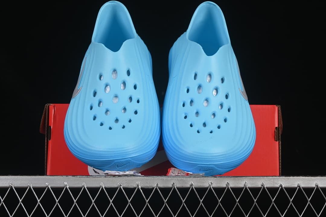 Pair of blue clogs viewed from the front