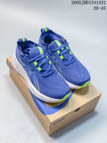 Pair of blue ASICS GEL-NIMBUS 26 running shoes with lime accents on a shoebox