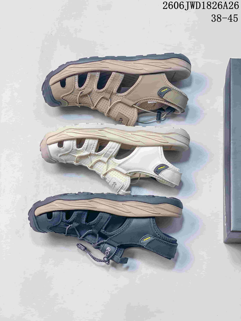 Side view of beige, white, and dark gray ECCO sandals showing open sides and contoured soles.