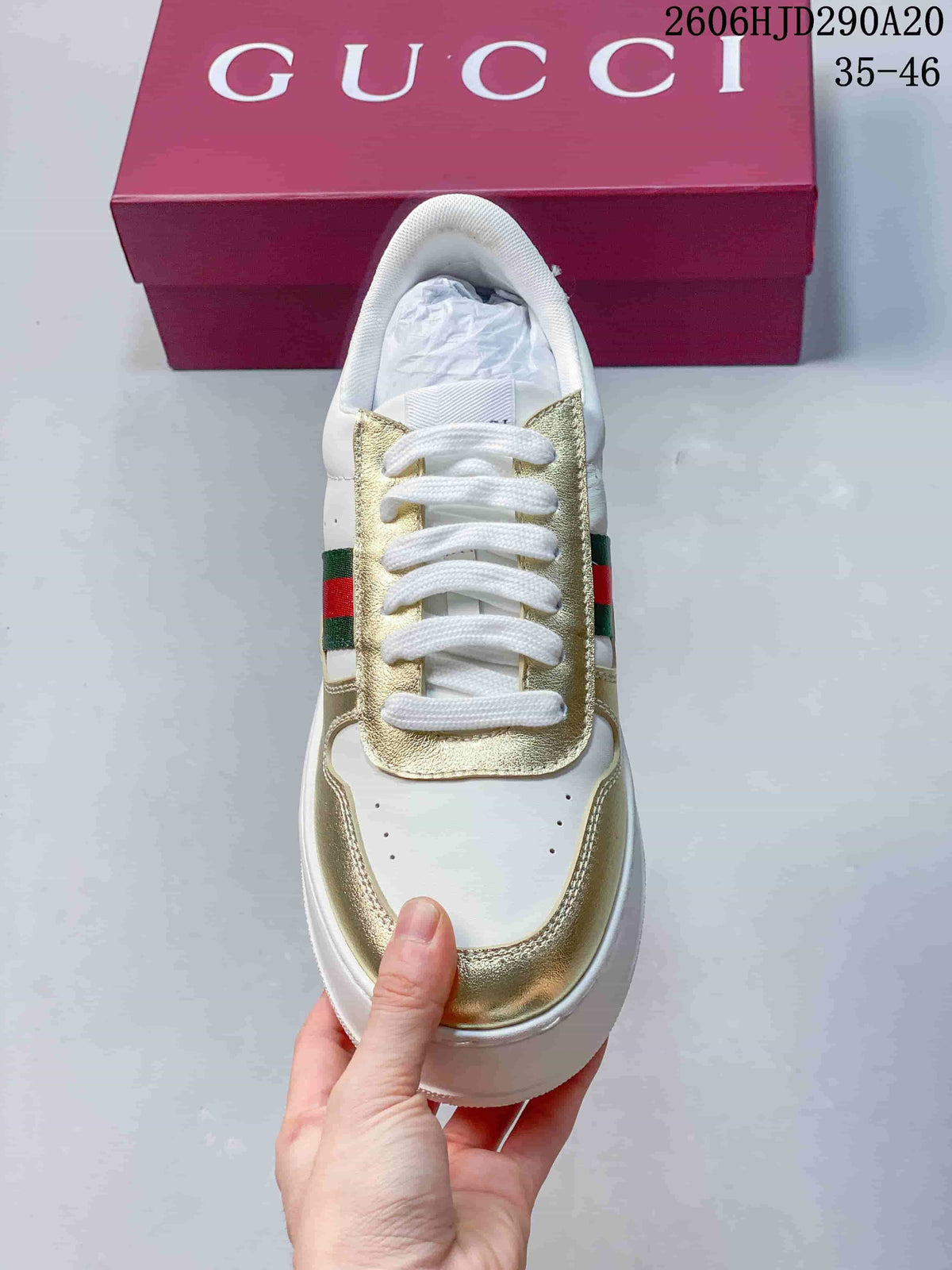 Top view of the lace-up sneaker with gold-tone eyestay and toe overlays