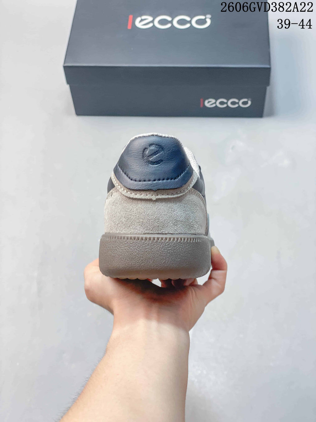 Rear view of the sneaker showing the layered heel and gray sole.
