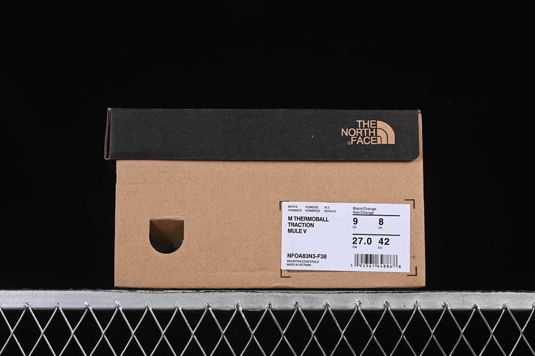 Shoebox label identifying the Black/Orange colorway and style NF0A83N3-F38.