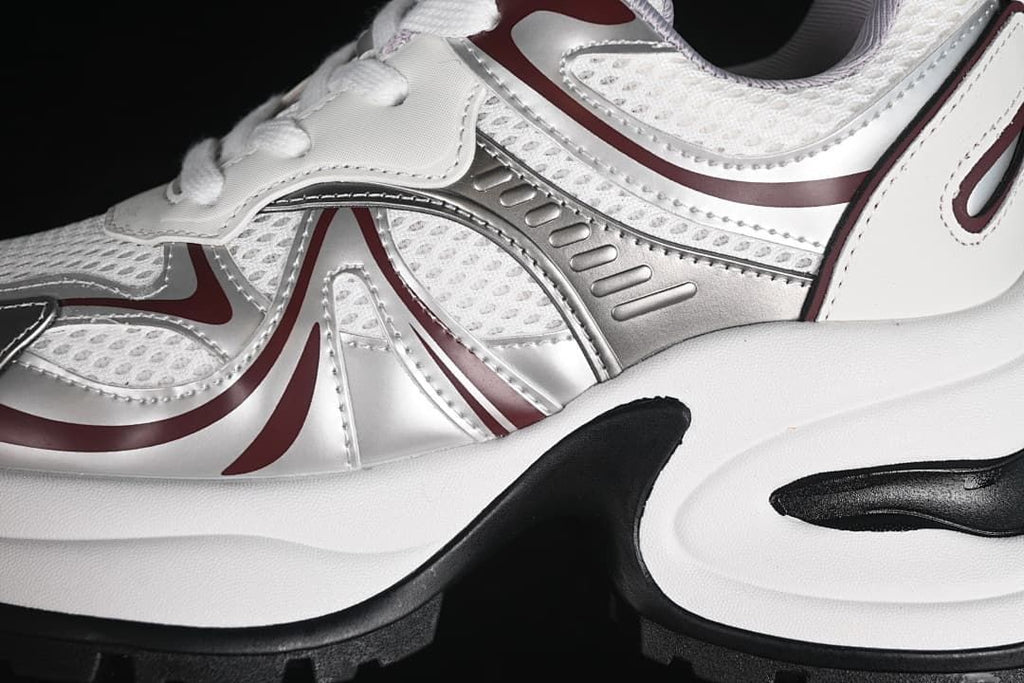 Close-up of mesh-look panels and metallic side detailing