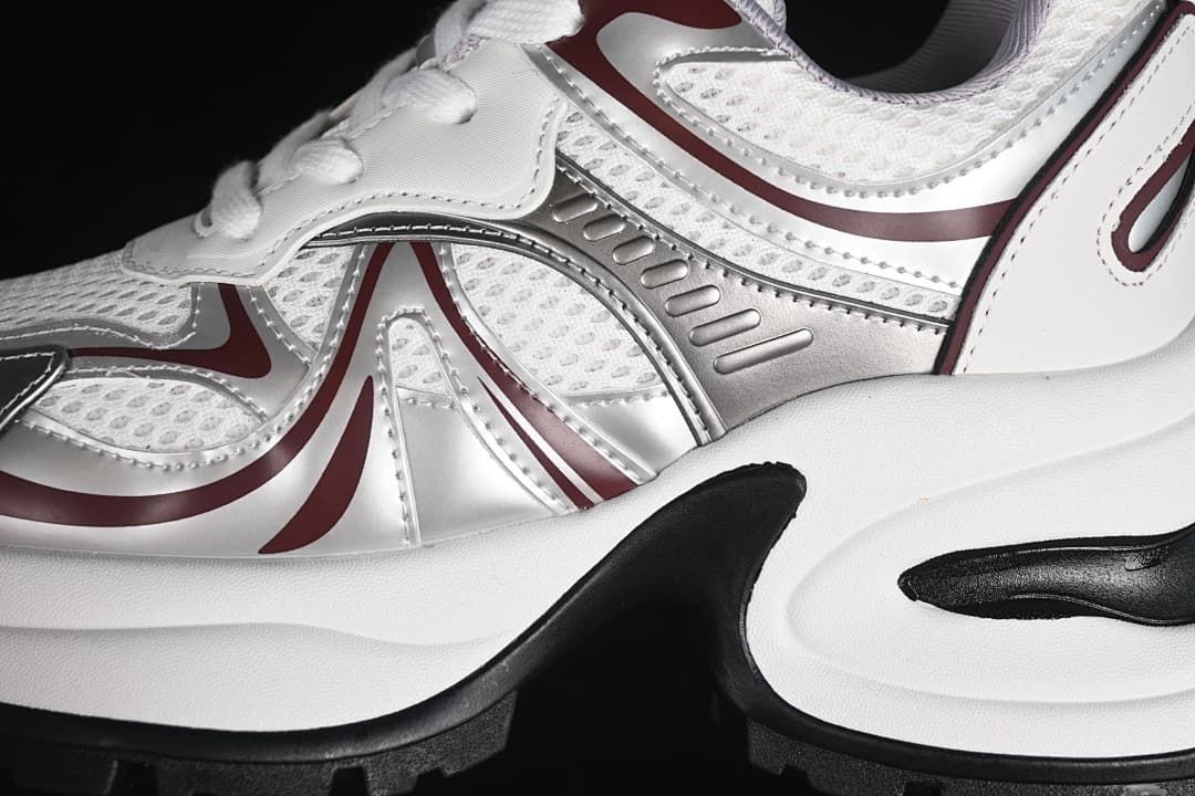 Close-up of mesh-look panels and metallic side detailing