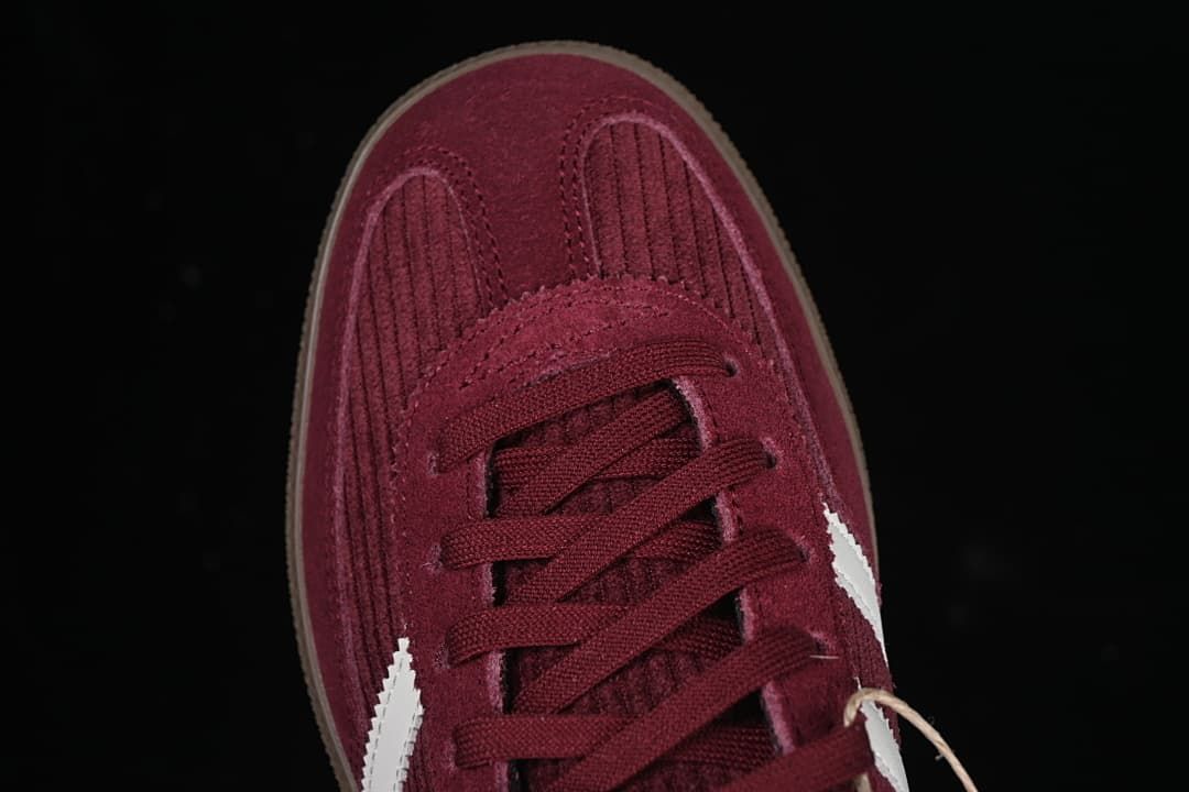 Top-down view of the burgundy sneaker's toe and lacing