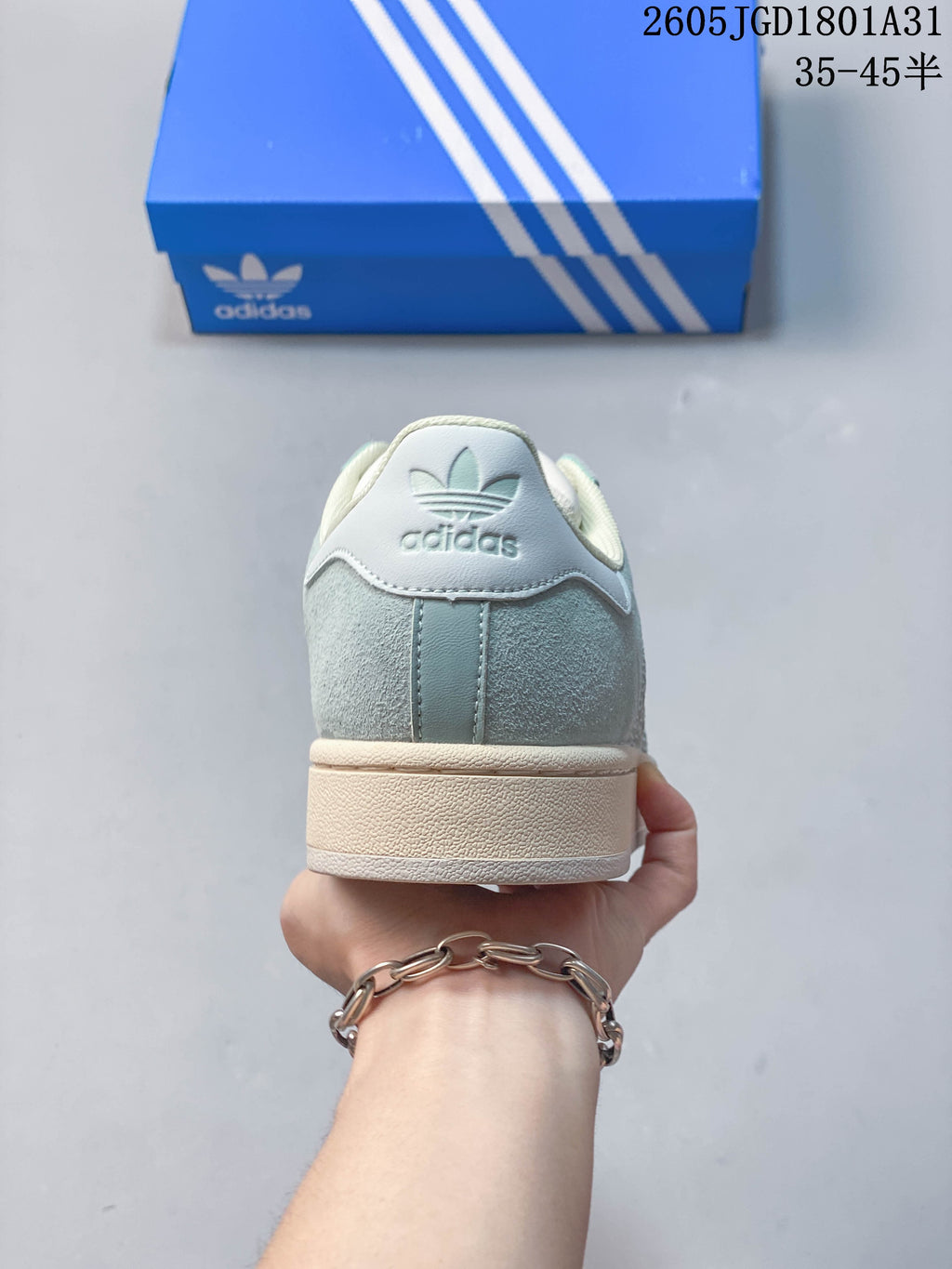Rear view showing the heel branding and cream-colored sole