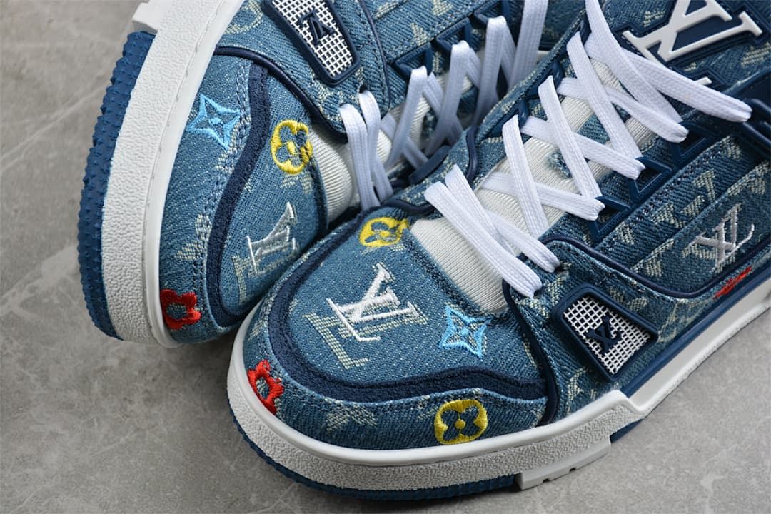 Close-up of the patterned blue toe, multicolor motifs and white midsole.