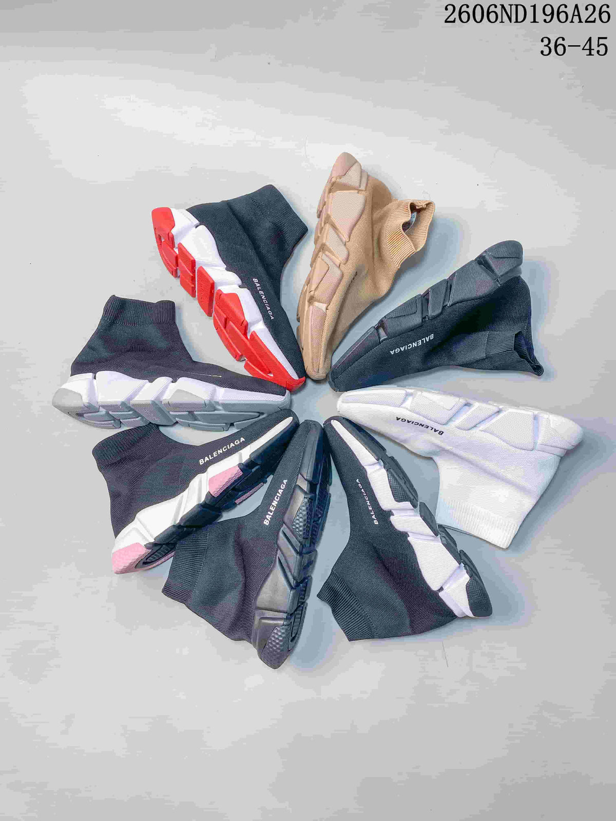 Several sock-style knit sneakers in dark blue, white and beige colorways