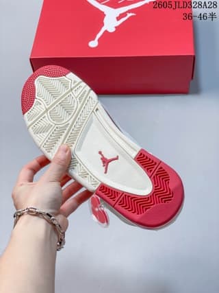 White and red outsole of an Air Jordan 4 sneaker