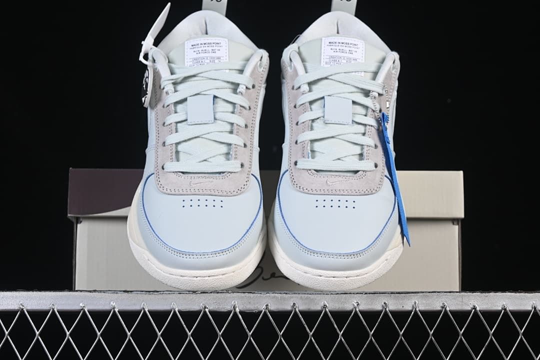 Front view of the pair showing perforated toes and blue accent piping