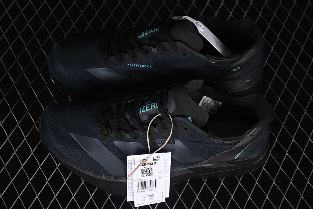 Pair of black running shoes with product hangtags