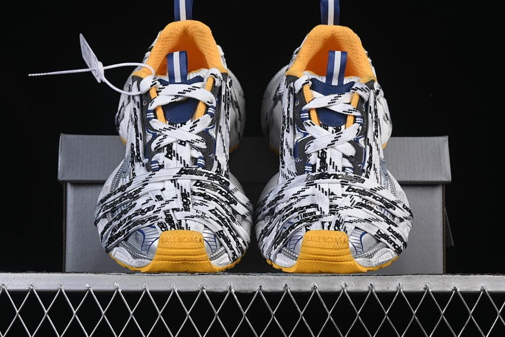 Front view of both sneakers displaying the layered lace design