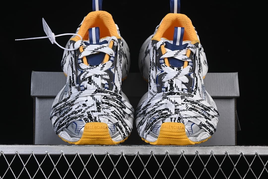 Front view of both sneakers displaying the layered lace design