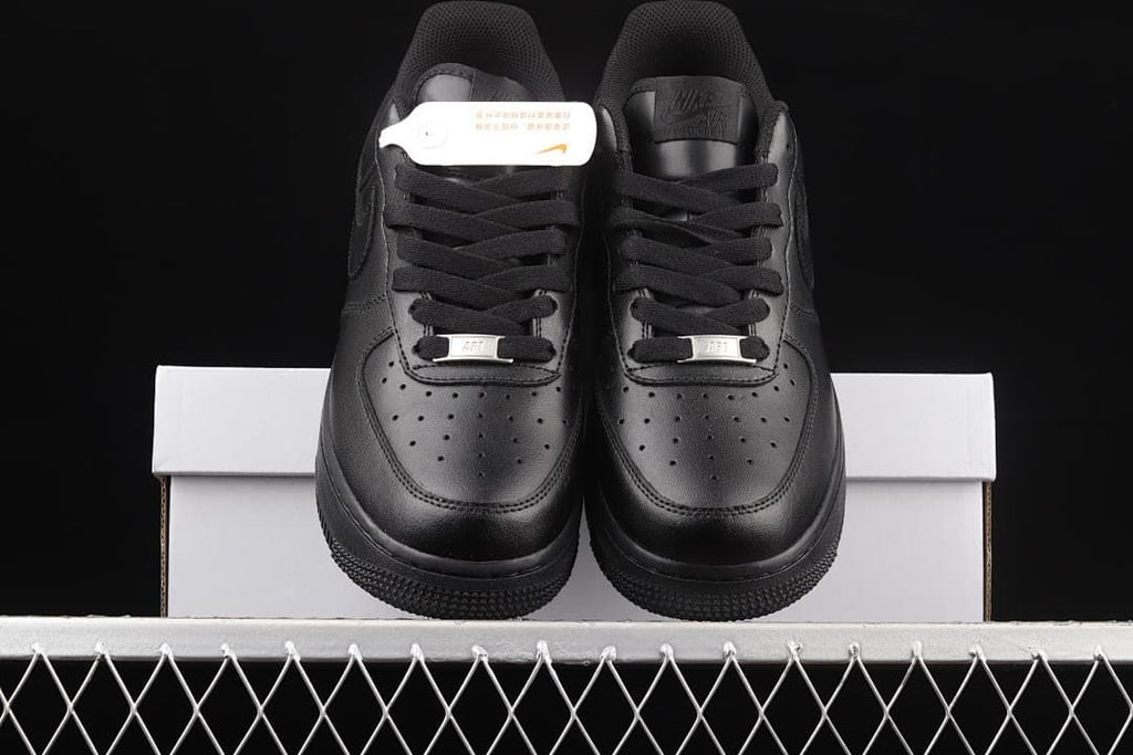 Front view of the pair showing perforated toes and black laces.