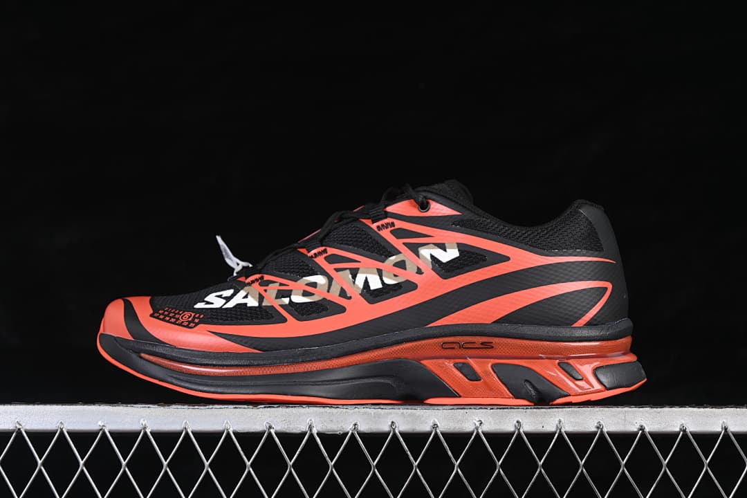 Side view of black and tomato-red Salomon XT-MM6 sneakers