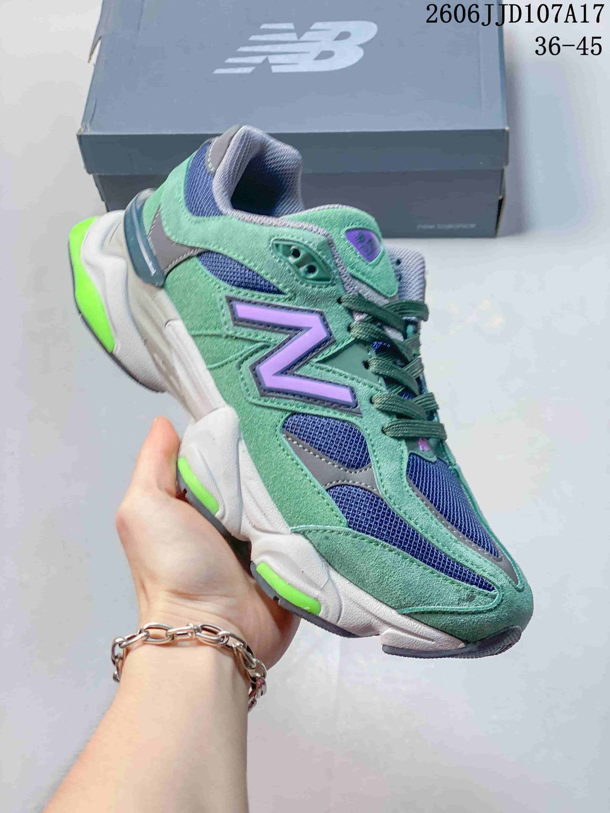 Angled side view of the green New Balance U9060 sneaker with navy mesh and purple branding