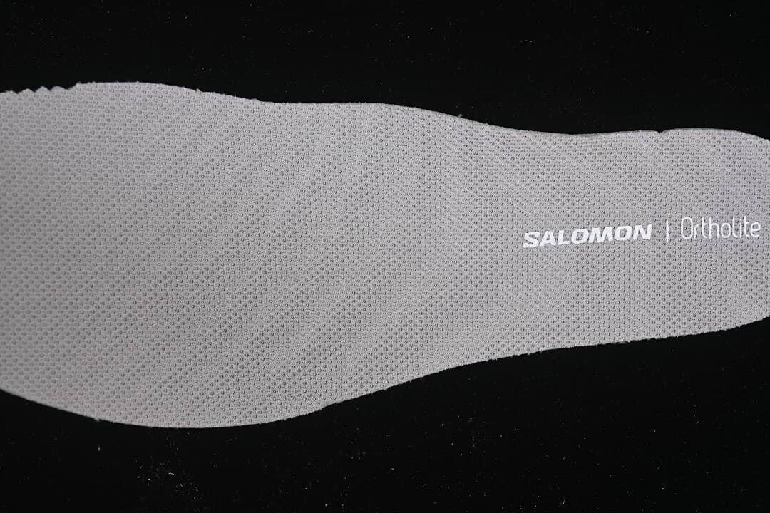 Close-up of a gray Salomon Ortholite insole.