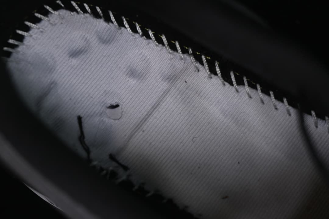 Close-up of the inside stitching and lining of the shoe