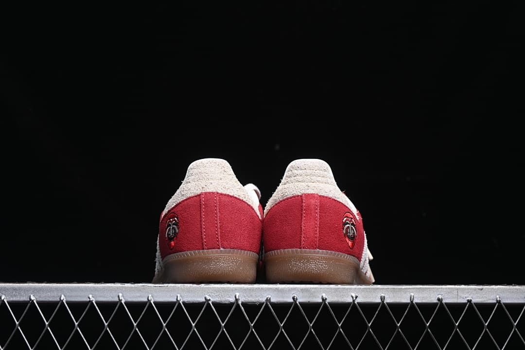 Rear view of both sneakers showing the heel panels and gum-colored outsoles.
