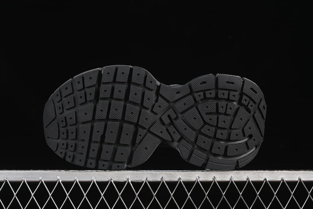 Underside view showing the segmented tread pattern.